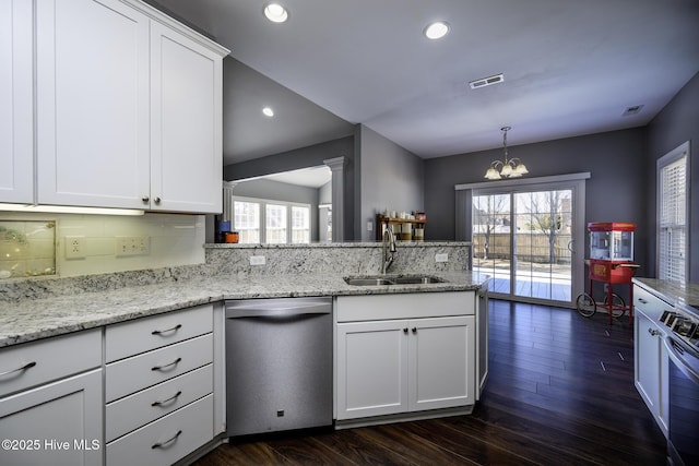 kitchen with appliances with stainless steel finishes, plenty of natural light, visible vents, and a sink