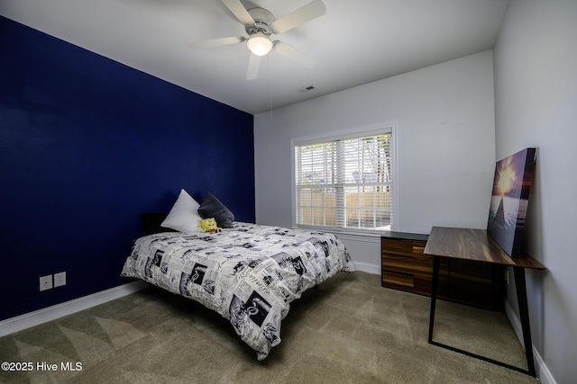 bedroom featuring ceiling fan, carpet flooring, visible vents, and baseboards