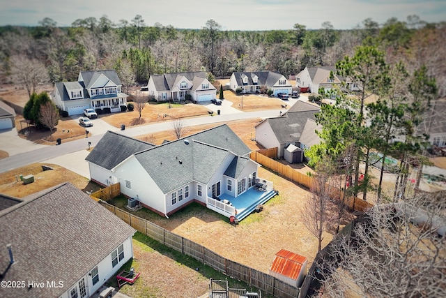 bird's eye view with a residential view and a view of trees