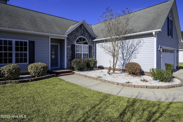 single story home with a garage, stone siding, roof with shingles, and a front lawn