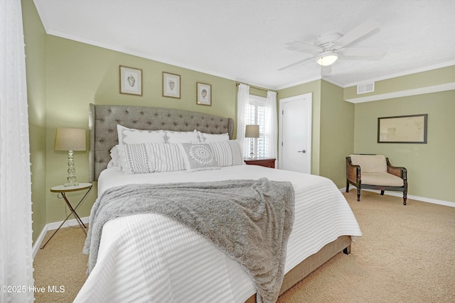 bedroom featuring carpet, baseboards, ceiling fan, and crown molding