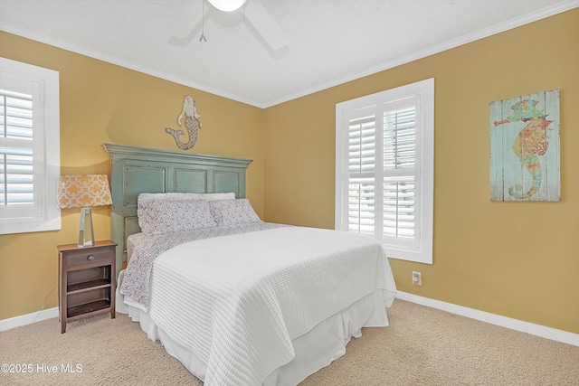 bedroom featuring ornamental molding, light colored carpet, ceiling fan, and baseboards