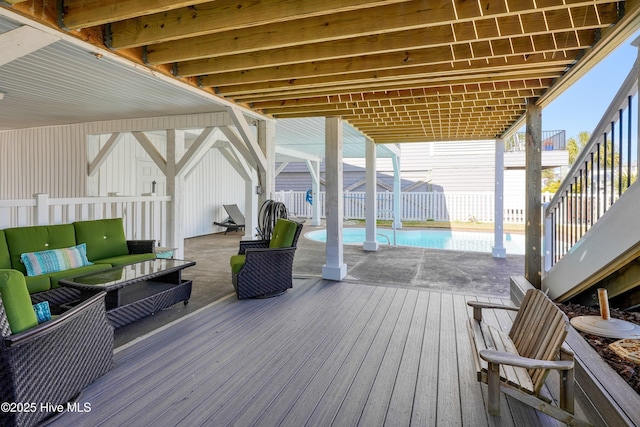 deck featuring a fenced in pool, stairs, fence, a patio area, and outdoor lounge area