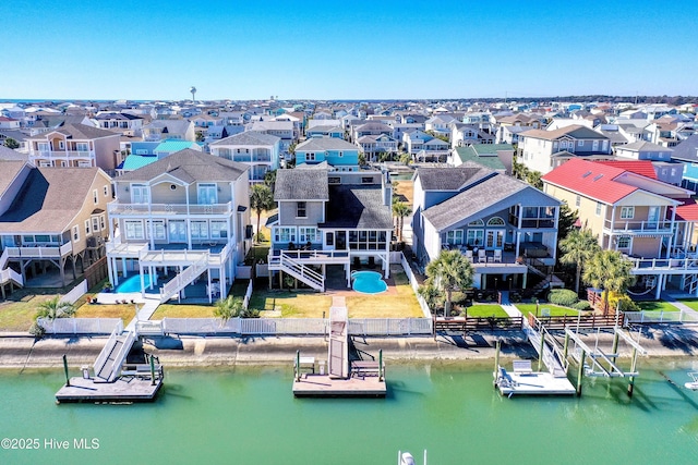 aerial view featuring a water view and a residential view