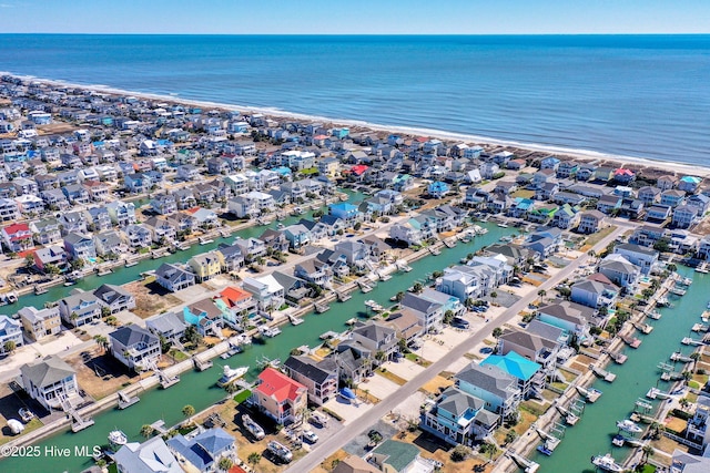 drone / aerial view featuring a residential view and a water view