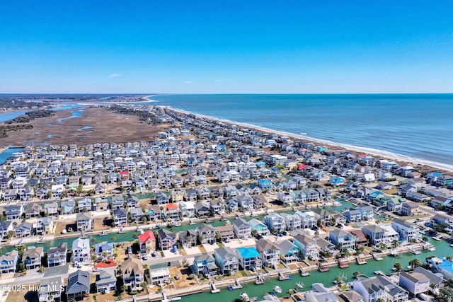 birds eye view of property with a beach view, a water view, and a residential view