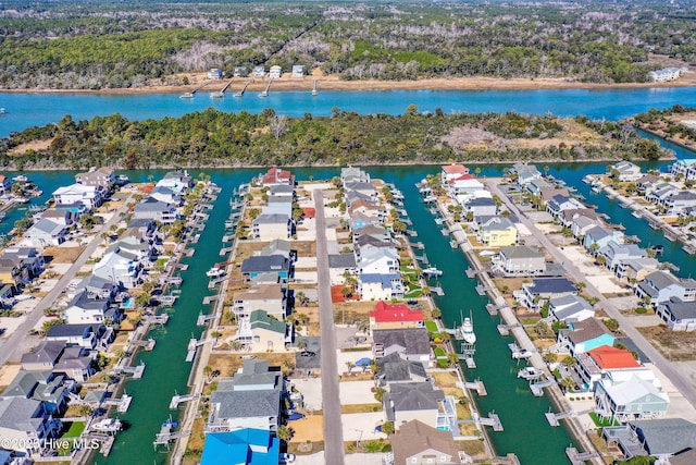 aerial view with a water view and a residential view