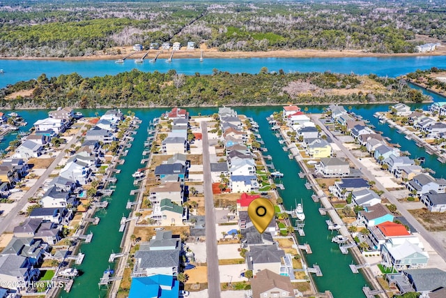 birds eye view of property featuring a water view and a residential view