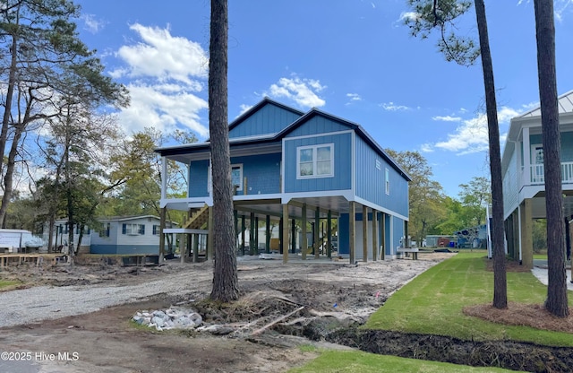 back of property with a carport