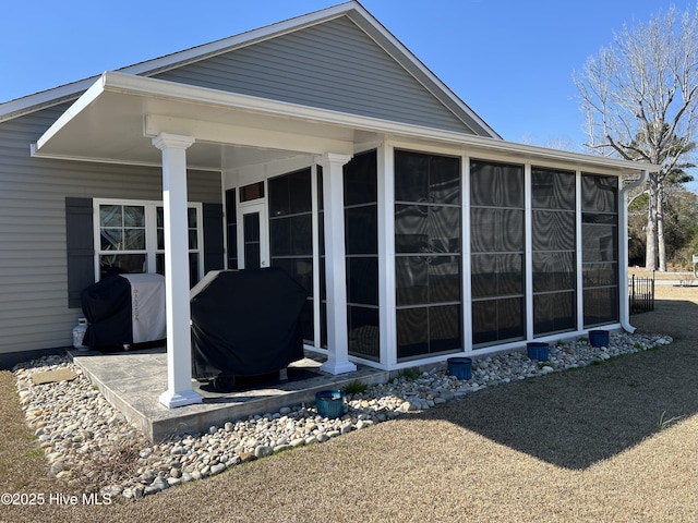 back of property featuring a sunroom