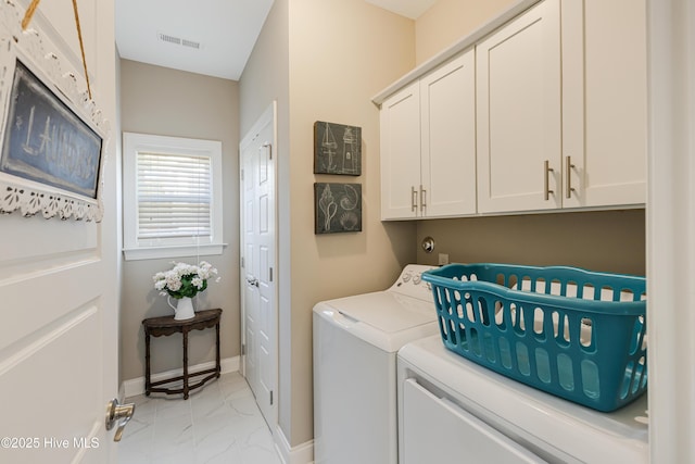 laundry area with cabinet space, visible vents, baseboards, marble finish floor, and washing machine and dryer