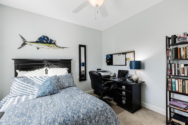 carpeted bedroom featuring ceiling fan and baseboards