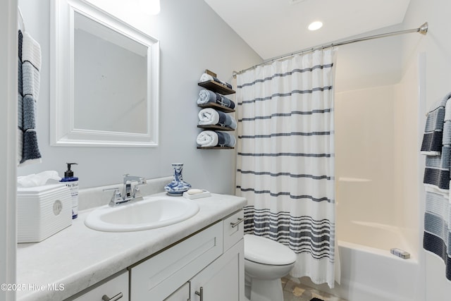 bathroom featuring vanity, toilet, and shower / bathtub combination with curtain