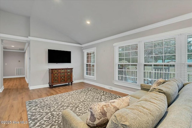 living area featuring wood finished floors, visible vents, baseboards, high vaulted ceiling, and crown molding