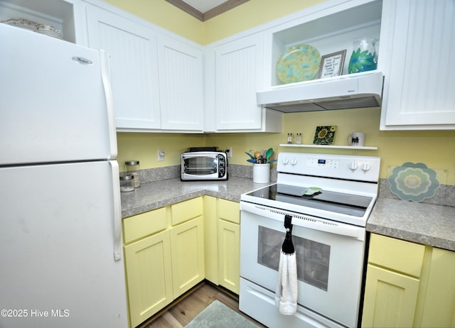 kitchen featuring a toaster, open shelves, wood finished floors, white appliances, and under cabinet range hood