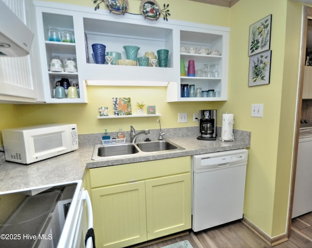 kitchen featuring white appliances, wood finished floors, a sink, ventilation hood, and open shelves