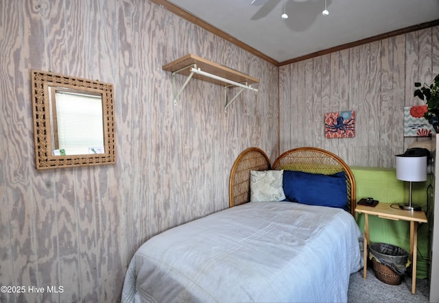 bedroom with carpet, a ceiling fan, and crown molding