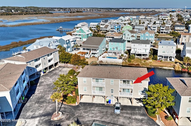 aerial view with a residential view and a water view