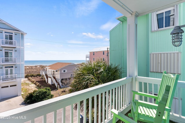 balcony featuring a water view