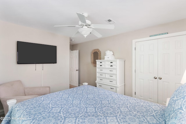 bedroom featuring a closet, visible vents, and a ceiling fan