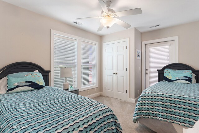 308 Carolina Beach Ave S Unit 1, Carolina Beach, NC 28428 - carpeted bedroom featuring baseboards and a ceiling fan