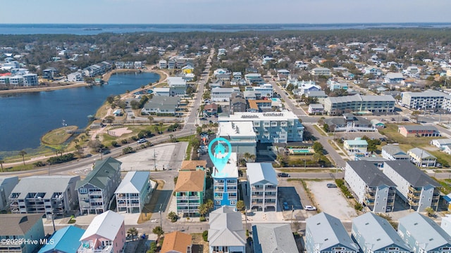 birds eye view of property with a water view and a residential view