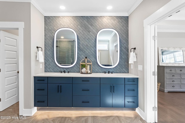 935 Baldwin Park Dr, Wilmington, NC 28411 - bathroom featuring crown molding, double vanity, baseboards, backsplash, and recessed lighting