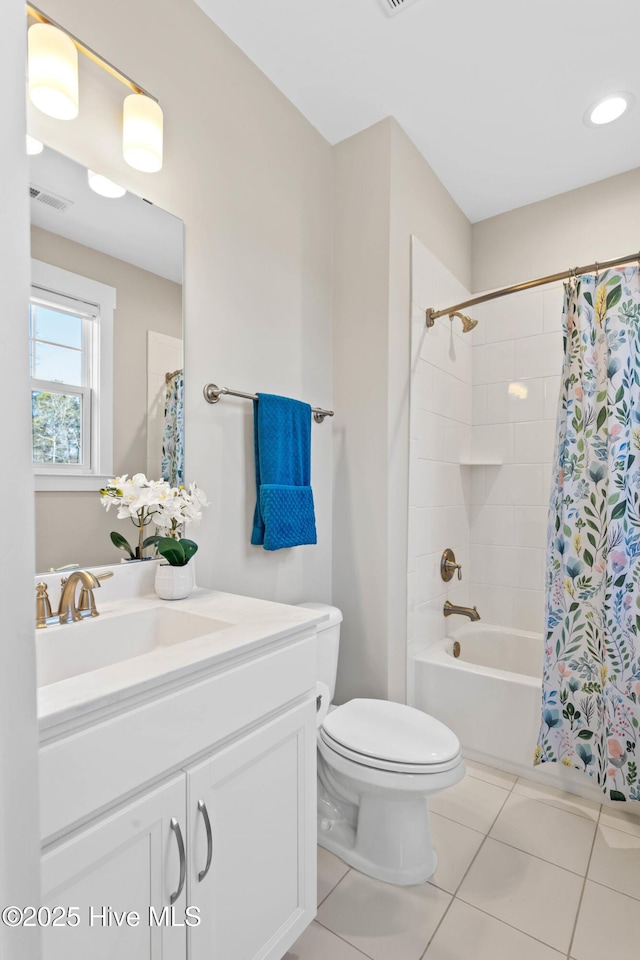 935 Baldwin Park Dr, Wilmington, NC 28411 - bathroom featuring toilet, vanity, tile patterned floors, and shower / tub combo with curtain