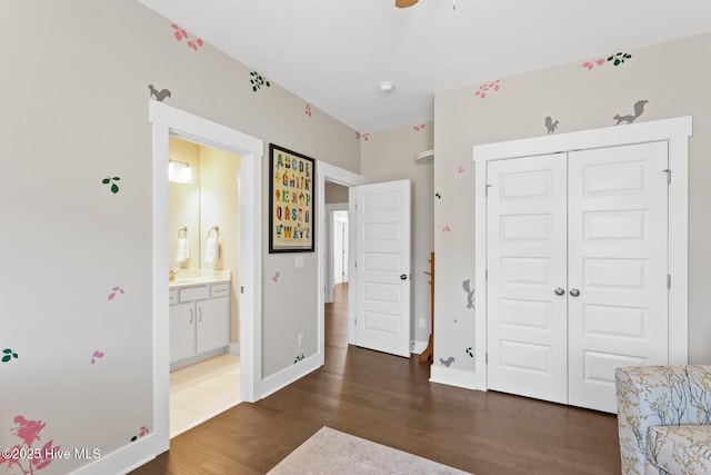 935 Baldwin Park Dr, Wilmington, NC 28411 - bedroom featuring wood finished floors, a closet, and ensuite bathroom