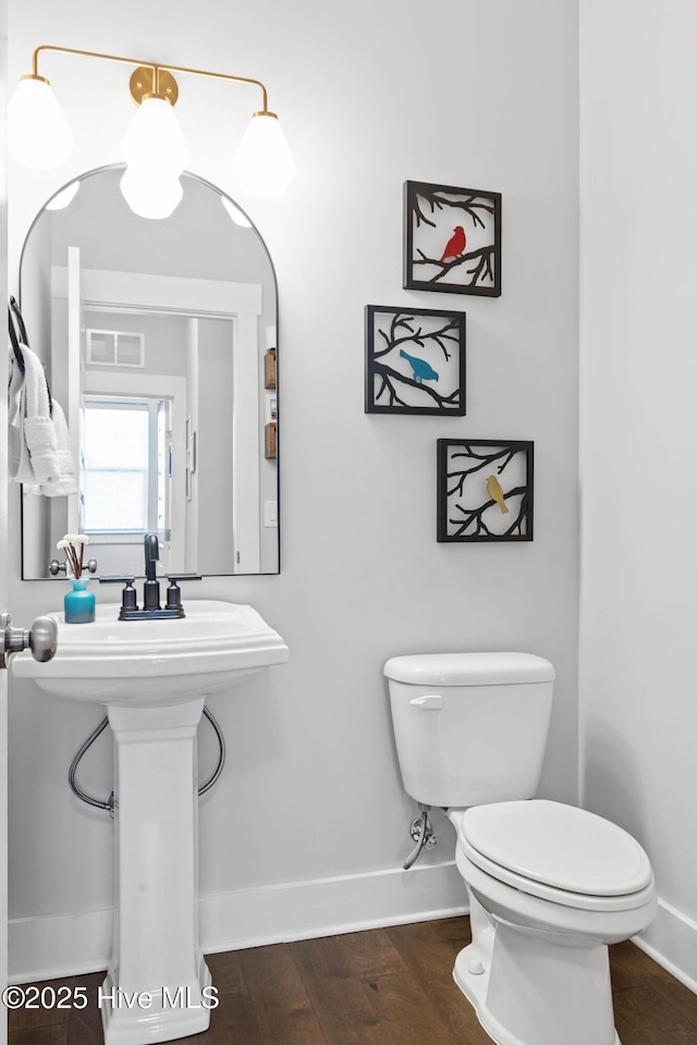 935 Baldwin Park Dr, Wilmington, NC 28411 - half bathroom with toilet, baseboards, and wood finished floors