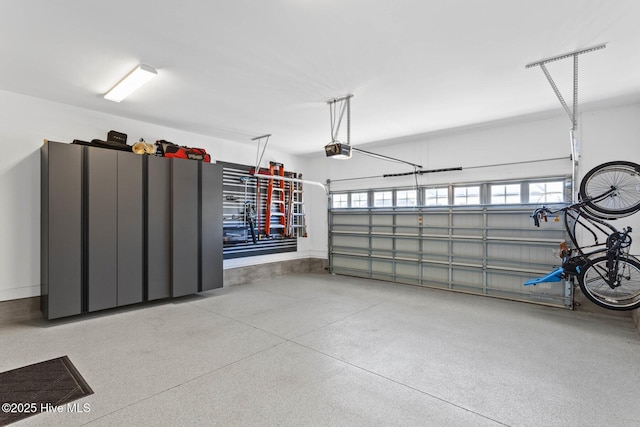 935 Baldwin Park Dr, Wilmington, NC 28411 - garage featuring a garage door opener and baseboards