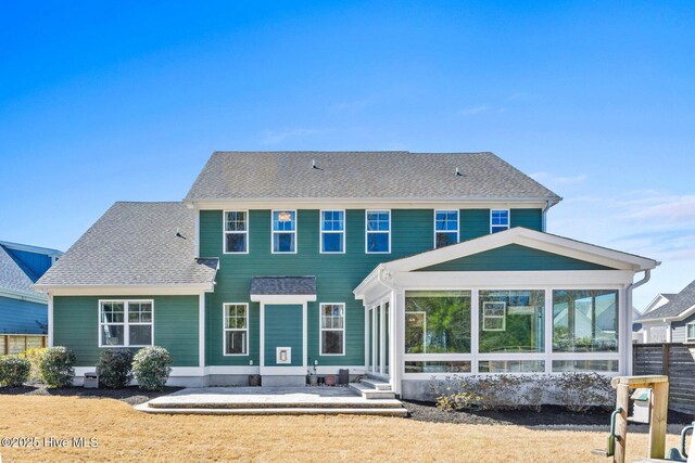 935 Baldwin Park Dr, Wilmington, NC 28411 - rear view of property with a sunroom, a patio, and roof with shingles
