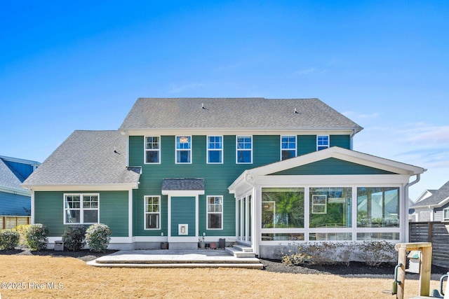 935 Baldwin Park Dr, Wilmington, NC 28411 - rear view of house featuring a sunroom, a patio area, and roof with shingles