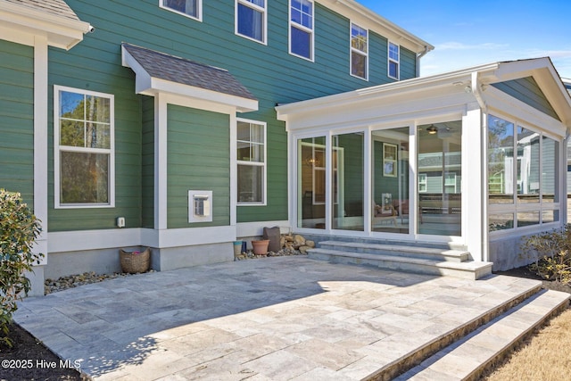 935 Baldwin Park Dr, Wilmington, NC 28411 - rear view of house with a sunroom, entry steps, and a patio
