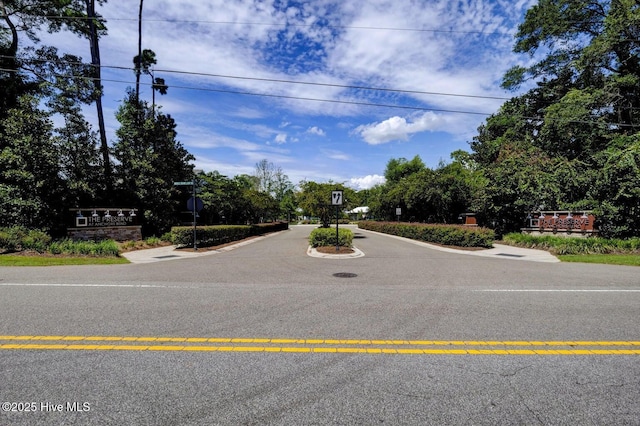 935 Baldwin Park Dr, Wilmington, NC 28411 - view of asphalt road with traffic signs