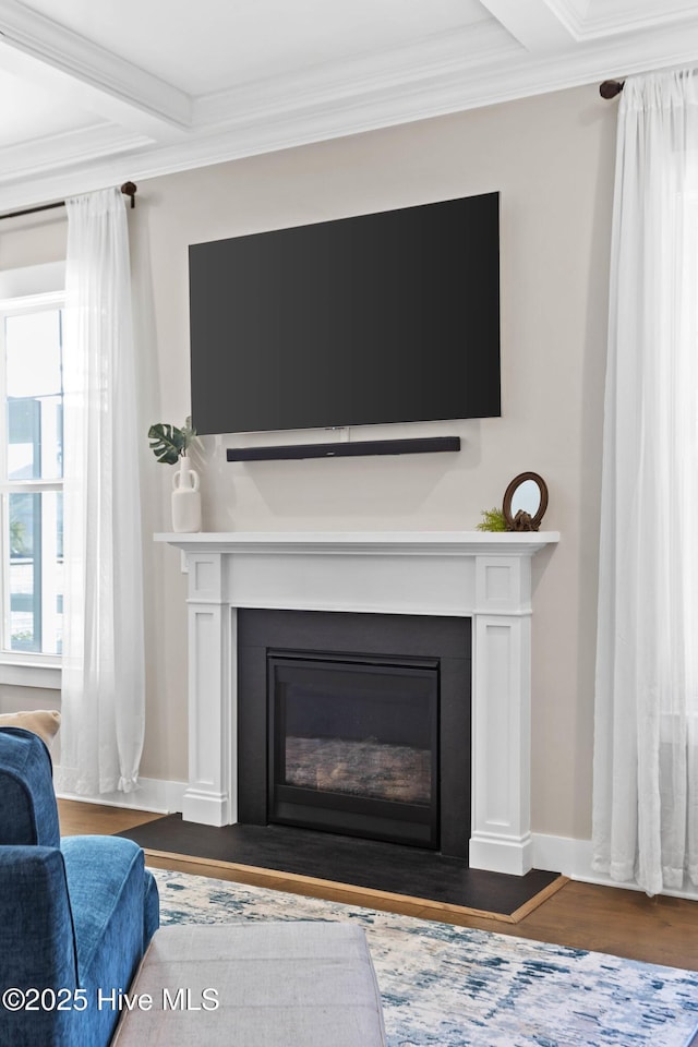 935 Baldwin Park Dr, Wilmington, NC 28411 - detailed view of a fireplace with flush hearth, ornamental molding, wood finished floors, and beam ceiling