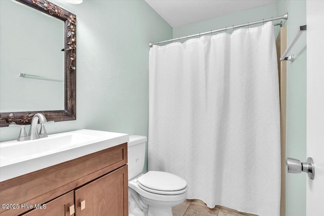 full bath featuring toilet, curtained shower, tile patterned flooring, and vanity