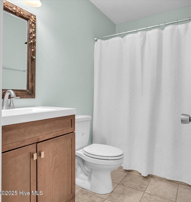 full bath with toilet and vanity