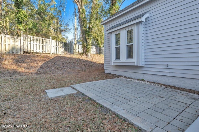 view of yard with fence and a patio