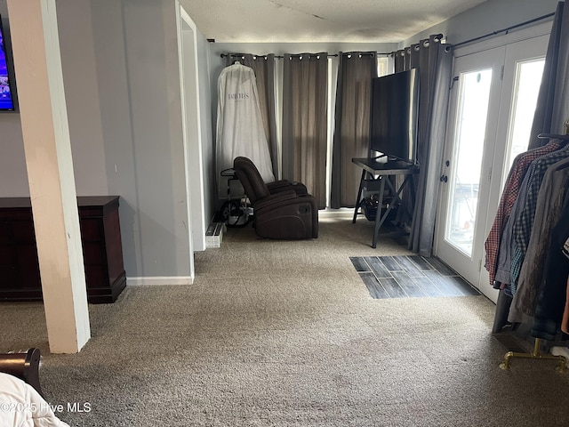 sitting room with light carpet and baseboards