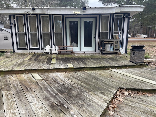 rear view of property featuring a deck