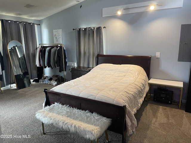 bedroom with electric panel, dark carpet, and vaulted ceiling