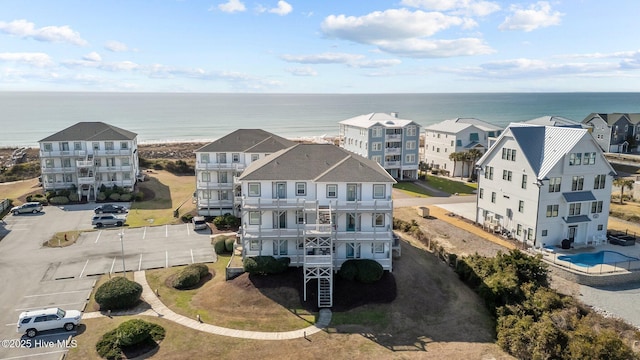 birds eye view of property featuring a residential view and a water view