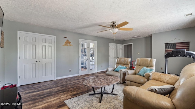 living area with french doors, dark wood finished floors, visible vents, and baseboards
