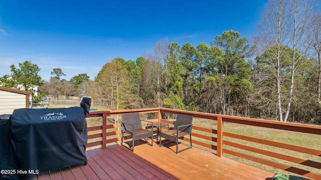 wooden terrace with grilling area