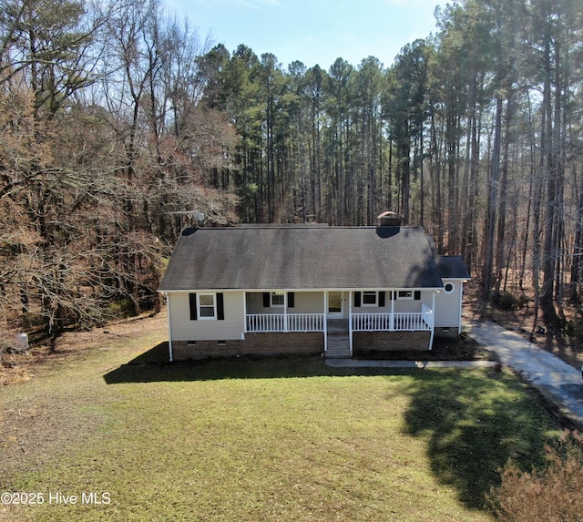 view of front of home with crawl space, covered porch, a front lawn, and roof with shingles