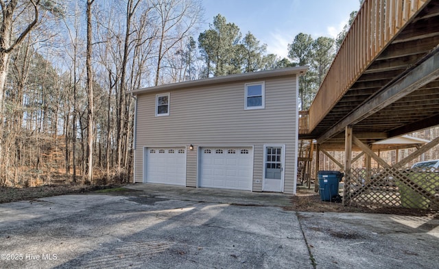 view of property exterior featuring an attached garage