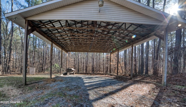 view of parking with a detached carport