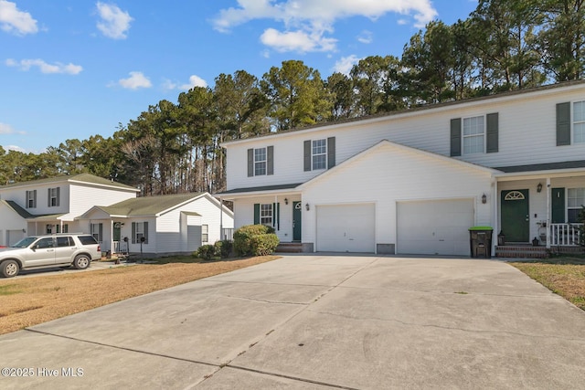 view of front of home with a garage and concrete driveway