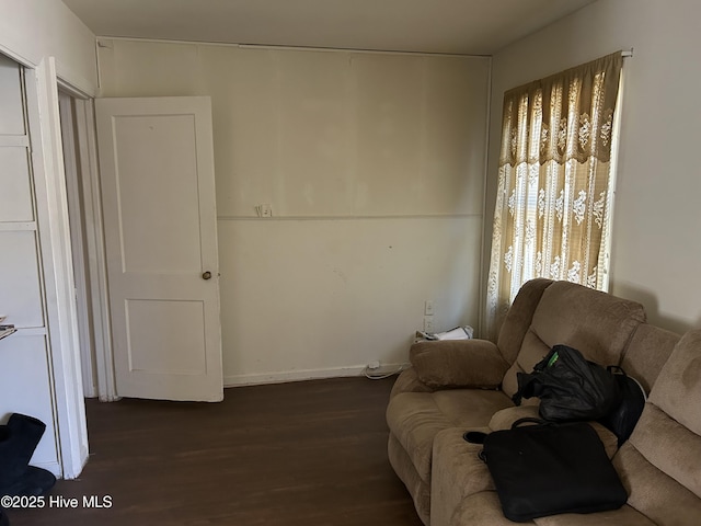 living area with dark wood-style flooring